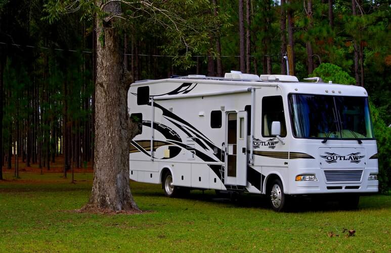 RV in a campground with trees